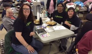 posAbilities team members and persons served at a clothing drive