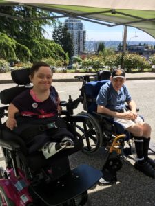 A woman and a man in wheelchairs