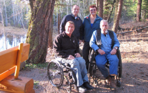 Rick Hansen and friends hiking on a trail