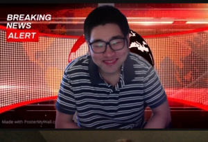 Asian man with glasses sitting in front of red Zoom background with "BREAKING NEWS" in top-left corner