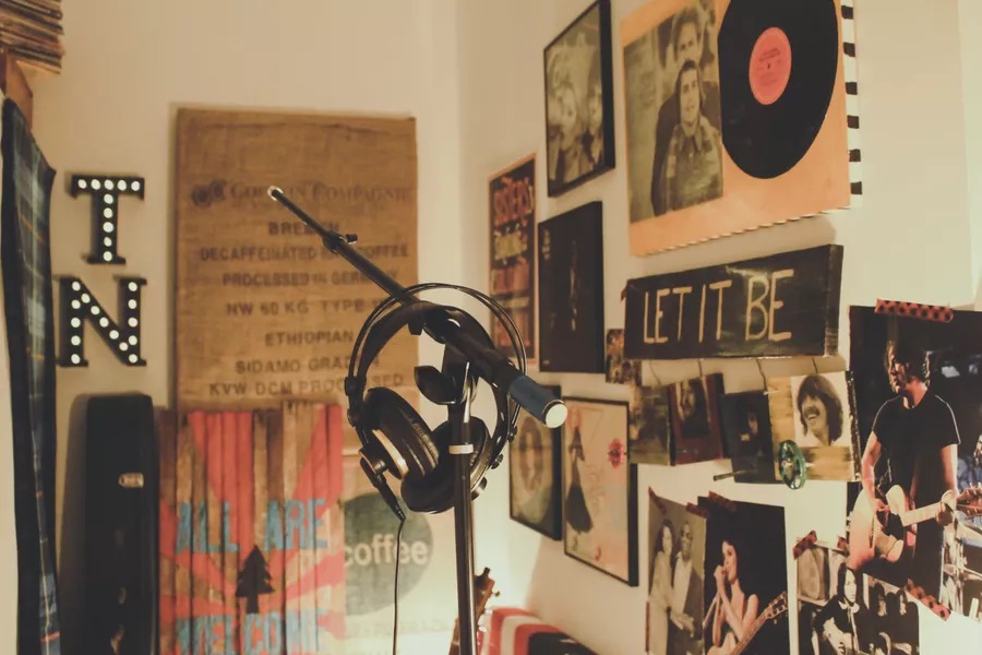 Music room with photos of bands on the wall
